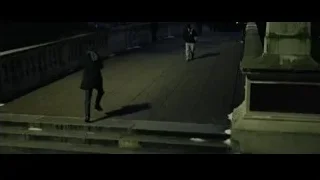 People walking on bridge at night — The Social Network