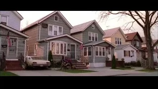 Row of houses on street with flags — Spider Man 2