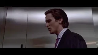 Man in suit by stainless steel door — American Psycho