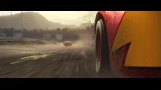 Red and yellow car driving fast on wet road — Cars 3