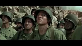 military men looking up at a large explosion — Hacksaw Ridge