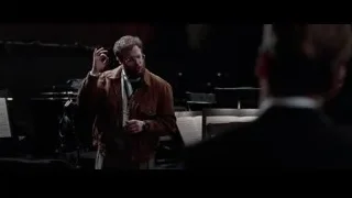Man speaking to conductor in music room — Steve Jobs