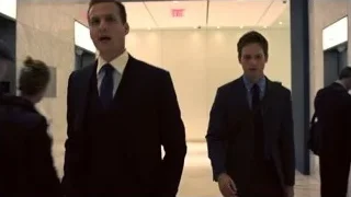 two men in suits walking in elevator — Suits