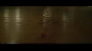 person lying on floor with dog and blood — John Wick