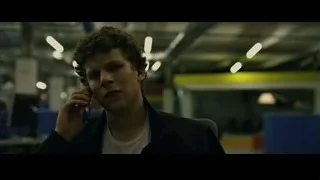 young man talking on phone in industrial office — The Social Network