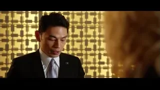 man in suit talking on phone to woman — Lucy