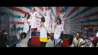 women on stage with American flag — The Big Short