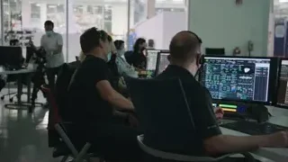 People working on computers in control room — Elon Musk: Return to Space