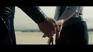 Man and woman holding hands in desert — Superman: Man of Steel