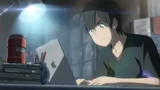 Young man focused on laptop screen — Weathering with You