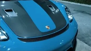 Two men in store with Electricians sign — Sports Cars