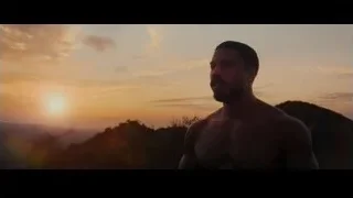 Man standing on hill looking at sunset — Creed 3