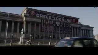 large building with Creed vs Conlan banner — Creed