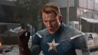 Captain America in front of burning building — The Avengers