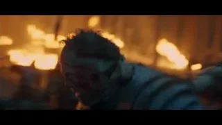 man in dark cloak in battle with fire — Gladiator