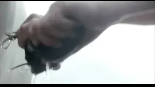 hand holding scissors cutting — Peaky Blinders