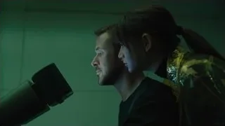 man and woman standing close with serious expressions — Blade Runner 2049