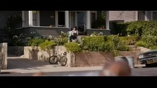 woman sitting on a house porch — Ford v Ferrari