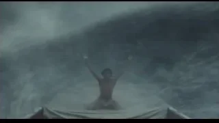 Person on boat in large wave — Life of Pi