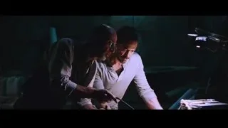 two men working on metal in dark — Iron Man
