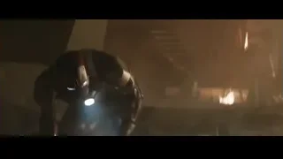 Robot in dark room with glowing eyes — Iron Man 3