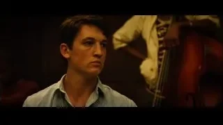 Young man with musician in background — Whiplash