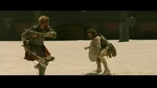 Two men battling in outdoor arena — Gladiator 2