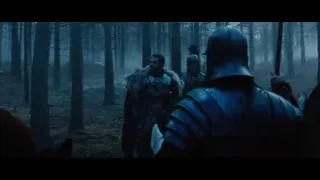 man in armor with sword in foggy forest — Gladiator