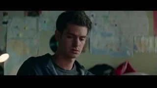 Young man sitting in room with map — The Amazing Spider Man 2