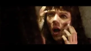 Bloody woman's face in shock or horror — Lucy