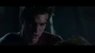 Close-up of man in red shirt with serious expression — The Amazing Spider Man