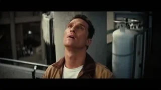 Man in brown jacket looking up in room — Interstellar