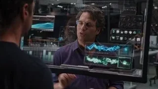 two men in futuristic control room with screens — The Avengers