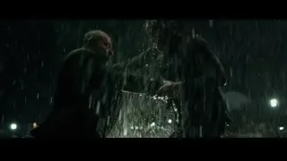 two men standing in the rain — John Wick