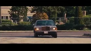 man in driver's seat of vintage car — The Wolf Of Wall Street