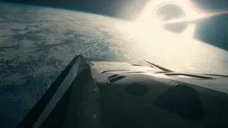 airplane wing flying above Earth with sun — Interstellar