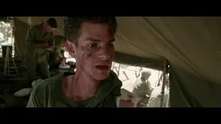 young man with bloody face in military tent — Hacksaw Ridge