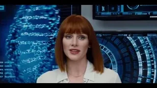 Red-haired woman viewing DNA on screens — Jurassic World