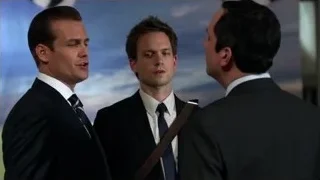 three men in suits conversing — Suits