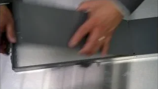 Hand placing dollar bill into metal tray — Breaking Bad