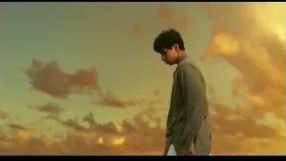 young man standing in front of sunset — Life of Pi