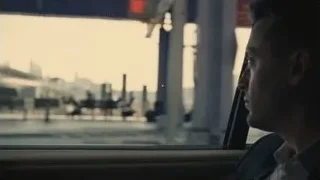 man looking out car window — Succession