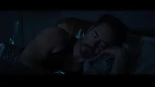 Man sleeping in dimly lit room with blue light — Iron Man 3