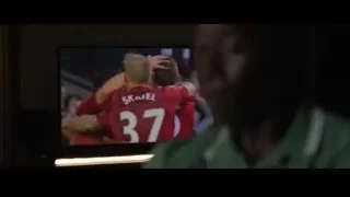 man in green shirt looking at screen — Iron Man 3