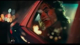 Joker in car smiling at night — Joker