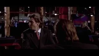 man in blazer and sunglasses talking — American Psycho