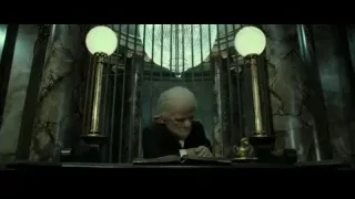 elderly man deep in thought at desk — Harry Potter and the Deathly Hallows 2