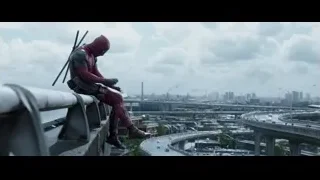 Deadpool on rooftop overlooking city — Deadpool
