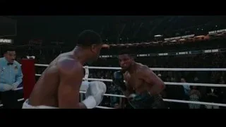 two boxers fighting in ring with referee — Creed 3