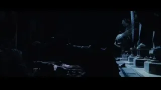People in dimly lit temple with dragon statue — Harry Potter and the Philosophers Stone